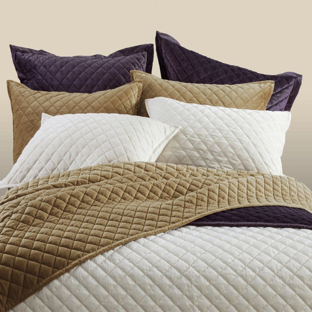 Velvet Diamond Quilted Euro Shams on a bed from HiEnd Accents